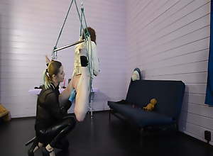 Mistress Celebrant tortures her bondaged slave with electro