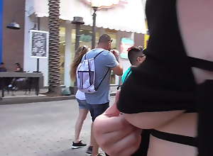 exhibitionist girl demonstrates pussy and tits in public