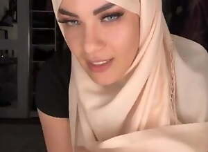 Arab girl wearing a hijab in leggings, big pair