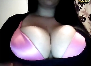 Huge breasts in a hot pink bra