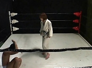Collared menial is totally beaten up by a domina in the ring