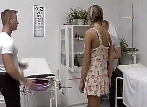 A beautiful blonde German teen receives screwed away from two horny doctors